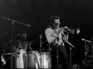 Miles Davis in performance: James Mtume (congas) and Miles Davis (trumpet)