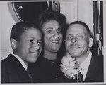 [Mrs. Constance B. Motley standing in between husband Joel, Jr. and son Joel Motley III]