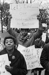 Demonstrators marching toward the Jefferson County Courthouse in downtown Birmingham, Alabama, for a voter registration rally.