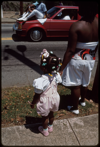 Atlanta, Georgia: 1988 West End Festival. Young African American girl's braids and hair decorations (parade spectators)