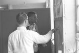 Young man from Bessemer High School discussing a math problem with his tutor in the basement of St. Paul's Lutheran Church in Birmingham, Alabama.