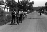 Edward Rudolph leading marchers down a street in Prattville, Alabama, during a demonstration sponsored by the Autauga County Improvement Association.