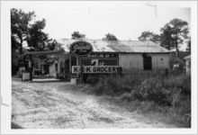 Roadside grocery with Ku Klux Klan sign