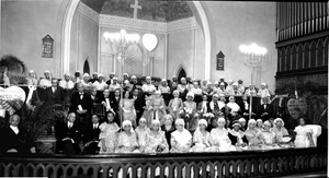 African American group seated in church, with heart-shaped sign about Crispus Attucks : acetate film photonegative