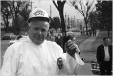 Klansman wearing a "UKA Security Guard" helmet during a Ku Klux Klan rally in Montgomery, Alabama.