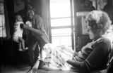 Josie Mae Jones sitting on a chair inside her home on Clayton Alley in Montgomery, Alabama.