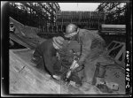 Baltimore, Maryland. Tightening bolts with a pneumatic wrench during the construction of the Liberty ship Frederick Douglass at the Bethlehem-Fairfield shipyards