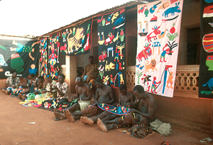 Appliqué workers, in street, Abomey, Benin