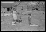 Mixed-breed Indian family, white and Negro, looking at location for new farmhouse near Pembroke Farms, North Carolina