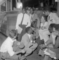 Fred Shuttlesworth with Freedom Riders in front of a bus at the Greyhound station in Birmingham, Alabama.