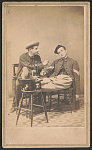 [Corporal Lucius T. Stanley of Co. A, 107th New York Infantry Regiment and Sergeant William E. Straight of Co. H and Co. F, 38th New York Infantry Regiment in uniform, smoking and drinking]