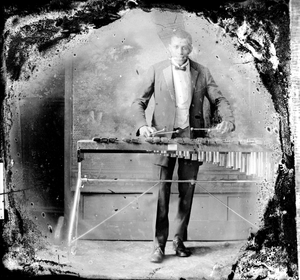 Man playing xylophone : nitrate film photonegative.