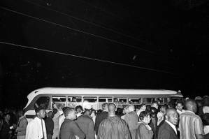 Bus amid a crowd of people at the "Stars for Freedom" rally at the City of St. Jude in Montgomery, Alabama, the night before the end of the Selma to Montgomery March.