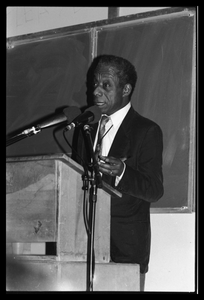 James Baldwin lecturing at UMass Amherst Baldwin standing at a podium with microphones