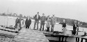 Unidentified group of men on pier