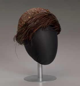 Brown feathered hat from Mae's Millinery Shop