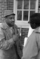 Scott B. Smith of SNCC speaking with Mike Bibler and John Davis of SCLC, in front of the Barbour County courthouse in Eufaula, Alabama.