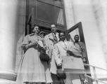 Autherine Lucy, Arthur Shores, and Thurgood Marshall outside the federal courthouse in Birmingham, Alabama, after a hearing.