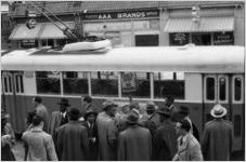 African American men preparing to board a segregated bus in an act of civil disobedience, Atlanta, Georgia, January 9, 1957.