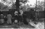 Negro family praying at graves of their relatives on All Saints' Day, New Roads, Louisiana