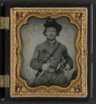 [Unidentified soldier in Union cavalry uniform with Colt Dragoon revolvers and sword]