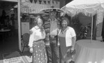 Ruth Washington posing with a man in a sombrero during a restaurant grand opening, Los Angeles, 1984