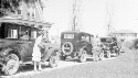 Thumbnail for A Chevrolet Family at Easter, Standing near cars left to right are Helen, Francis, and Russell, 3907 Seminary Avenue