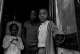 Children of Rosa Lee Turner standing at the back door of their house in Montgomery, Alabama.