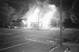 Buildings on fire at the corner of 6th Avenue North and 15th Street North in Birmingham, Alabama, after the bombing of the Gaston Motel.