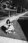 Mother and baby daughter in front yard