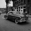 Damaged car in the street after the bombing of 16th Street Baptist Church in Birmingham, Alabama.