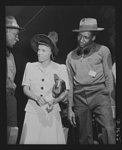 Production. Launching of the SS Booker T. Washington. Elaine Mulzac, daughter of Captain Hugh Mulzac, Negro skipper of the SS Booker T. Washington, talks to two Negro workmen who helped construct the first Liberty Ship named for a Negro