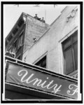 Police guard the rooftop of the Unity funeral home where the body of slain Black Nationalist leader Malcolm X is reposing