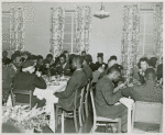 African American wounded soldiers, sailors, marines and Coast Guardsmen sitting at tables and enjoying their Thanksgiving dinner, at Lucy D. Slowe Hall, Washington, D. C