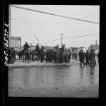 Detroit, Michigan. Riot at the Sojourner Truth homes, a new U.S. federal housing project, caused by white neighbors' attempt to prevent Negro tenants from moving in. Mounted police moving a group of Negroes