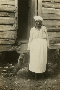 Gullah woman in front of her house