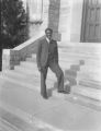 Ralph Metcalfe standing on steps at Xavier University, 1936