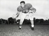 Lowell Williams smiles as he poses on the field, 1949