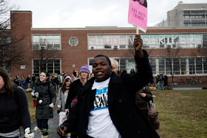 Justice for Jason rally at UMass Amherst: protesters marching from the Student Union Building in support of Jason Vassell