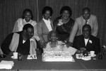 Mrs. Baskerville posing with her family and her birthday cake, Los Angeles, 1985