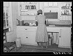 Cube Walker's wife, Negro tenant purchase client, in the kitchen of her new house. Mississippi Delta, Mississippi, Belzoni