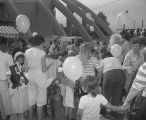 Children and adults in front of Garrett Coliseum during the 1985 South Alabama Fair in Montgomery, Alabama, for an event sponsored by McDonald's.