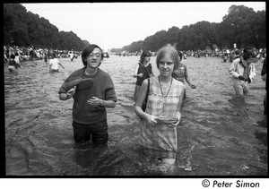 Splashing in the Reflecting Pond during the Poor Peoples’ Campaign Solidarity Day Raymond Mungo, shoes around his neck, with friend Lottie