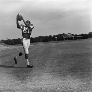 NTSU football player catching a ball