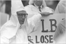 Klansman carrying a sign at a Ku Klux Klan rally in Montgomery, Alabama.