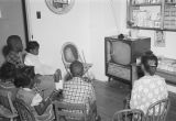 Children seated around a television at the Children's Hope Center at 487 South Jackson Street in Montgomery, Alabama.