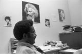 John Blassingame: New York. John Blassingame seated in office, Fredrick Douglas portrait on the wall (BLJP 1-79 #101)