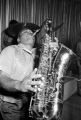 Bobby Moore playing the saxophone on stage at the Laicos Club in Montgomery, Alabama, during a performance by his group, Bobby Moore and the Rhythm Aces.