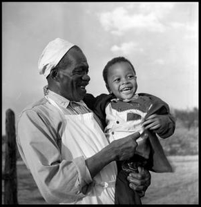 Oliver Jacobs Holding a Grandchild