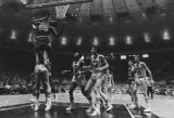 Joe Thomas attempts to prevent St. John's from scoring, while teammate Jeff Sewell looks on, 1970